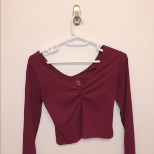 Low-cut maroon long-sleeved top
